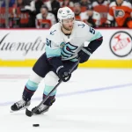 Oct 20, 2025; Philadelphia, Pennsylvania, USA; Seattle Kraken center Shane Wright (51) controls the puck against the Philadelphia Flyers in the third period at Xfinity Mobile Arena.