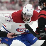 May 29, 2026; Raleigh, North Carolina, USA; Montreal Canadiens center Kirby Dach (77) prepares for a faceoff against Carolina Hurricanes left wing Mark Jankowski (77) in game five of the Eastern Conference Final of the 2026 Stanley Cup Playoffs during the second period at Lenovo Center.