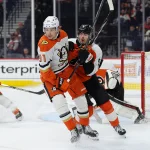 Jan 11, 2025; Philadelphia, Pennsylvania, USA; Anaheim Ducks center Leo Carlsson (91) collides with Philadelphia Flyers defenseman Jamie Drysdale (9) in the second period at Wells Fargo Center.
