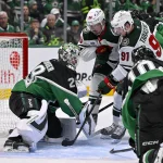 Apr 20, 2026; Dallas, Texas, USA; Minnesota Wild left wing Marcus Johansson (90) and right wing Vladimir Tarasenko (91) attempt to poke the puck past Dallas Stars goaltender Jake Oettinger (29) during the third period in game two of the first round of the 2026 Stanley Cup Playoffs at American Airlines Center.