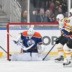 Dec 31, 2025; Edmonton, Alberta, CAN; Edmonton Oilers goalie Connor Ingram (39) looks for the puck as Boston Bruins center Elias Lindholm (28) and right winger David Pastrnak (88) look on during the first period at Rogers Place.