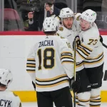 Mar 26, 2024; Sunrise, Florida, USA; Boston Bruins right wing David Pastrnak (88), Boston Bruins defenseman Charlie McAvoy (73) and Boston Bruins center Pavel Zacha (18) celebrate Pasternak's goal against the Florida Panthers during the second period at Amerant Bank Arena.