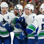 Mar 30, 2026; Las Vegas, Nevada, USA; Vancouver Canucks right wing Brock Boeser (6) celebrates with team mates after scoring a goal against the Vegas Golden Knights during the second period at T-Mobile Arena.