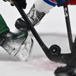 Nov 20, 2023; Dallas, Texas, USA; A view of the Dallas Stars logo on a NHL puck during a face-off between the Dallas Stars and the New York Rangers in the third period at the American Airlines Center.