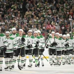 Apr 30, 2026; Saint Paul, Minnesota, USA; Dallas Stars forward Jamie Benn (14) leads his team in the handshake line after losing the series to the Minnesota Wild in the first round of the 2026 Stanley Cup Playoffs at Grand Casino Arena.