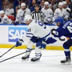 Apr 29, 2023; Tampa, Florida, USA; Toronto Maple Leafs center John Tavares (91) controls the puck from Tampa Bay Lightning defenseman Darren Raddysh (43) in overtime during game six of the first round of the 2023 Stanley Cup Playoffs at Amalie Arena.