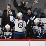 Jan 19, 2026; Chicago, Illinois, USA; Winnipeg Jets center Jonathan Toews (19) acknowledges the crowd during the first period of his first game back at the United Center since leaving the Chicago Blackhawks.