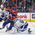 Feb 1, 2025; Edmonton, Alberta, CAN; Toronto Maple Leafs defensemen Morgan Rielly (44) knocks Edmonton Oilers forward Corey Perry (90) into goaltender Joseph Wall (60) during the first period at Rogers Place.