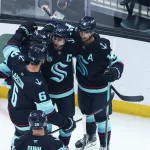 Apr 2, 2026; Seattle, Washington, USA; Seattle Kraken right wing Jordan Eberle (7) celebrates a goal with center Jared McCann (19) and center Matty Beniers (10) in the first period against the Utah Mammoth at Climate Pledge Arena.