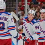 Apr 13, 2026; Sunrise, Florida, USA; New York Rangers right wing Gabe Perreault (94) celebrates with left wing Alexis Lafreniere (13) after scoring against the Florida Panthers during the second period at Amerant Bank Arena.