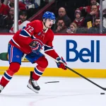 Jan 10, 2026; Montreal, Quebec, CAN; Montreal Canadiens defenseman Arber Xhekaj (72) plays the puck against the Detroit Red Wings during the third period at Bell Centre.