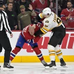 Nov 15, 2025; Montreal, Quebec, CAN; Montreal Canadiens defenseman Jayden Struble (47) fights Boston Bruins defenseman Nikita Zadorov (91) during the first period at the Bell Centre.