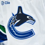 Jan 12, 2026; Montreal, Quebec, CAN; View of a Vancouver Canucks logo on a jersey worn by a member of the team during the second period at Bell Centre.