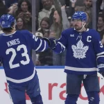 Mar 12, 2026; Toronto, Ontario, CAN; Toronto Maple Leafs forward Matthew Knies (23) congratulates forward Auston Matthews (34) on his goal against the Anaheim Ducks during the second period at Scotiabank Arena.