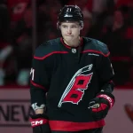 Nov 6, 2025; Raleigh, North Carolina, USA; Carolina Hurricanes defenseman Alexander Nikishin (21) looks on before the start of the game against the Minnesota Wild at Lenovo Center.