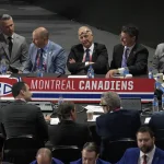 Jul 8, 2022; Montreal, Quebec, CANADA; General view of the Montreal Canadiens table during the second round of the 2022 NHL Draft at the Bell Centre. Montreal Canadiens head coach Martin St-Louis and General Manager Kent Hughes on the left.