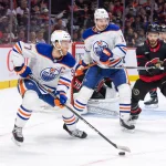 Mar 24, 2024; Ottawa, Ontario, CAN; Edmonton Oilers center Connor McDavid (87) skates with the puck in front of Ottawa Senators goalie Joonas Korpisalo (70) in the second period at the Canadian Tire Centre.
