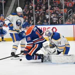 Dec 9, 2025; Edmonton, Alberta, CAN; Edmonton Oilers left winger Zach Hyman (18) gets in front of Buffalo Sabres goalie Alex Lyon (34) during the third period at Rogers Place.