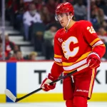Apr 14, 2026; Calgary, Alberta, CAN; Calgary Flames defenseman Zach Whitecloud (28) against the Colorado Avalanche during the first period at Scotiabank Saddledome.