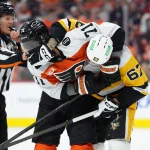 Apr 29, 2026; Philadelphia, Pennsylvania, USA; Philadelphia Flyers right wing Tyson Foerster (71) grapples with Pittsburgh Penguins right wing Rickard Rakell (67) in the first period in game six of the first round of the 2026 Stanley Cup Playoffs at Xfinity Mobile Arena.