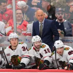 Oct 7, 2025; Sunrise, Florida, USA; Chicago Blackhawks head coach Jeff Blashill watches from the bench against the Florida Panthers during the third period at Amerant Bank Arena.