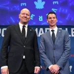 May 4, 2026; Toronto, Ontario, CANADA; Toronto Maple Leafs new senior executive advisor Mats Sundin (l) and general manager John Chayka pose for picture after an introductory news conference at Real Sports Bar and Grill.