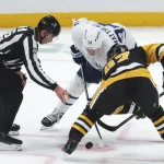 Nov 29, 2025; Pittsburgh, Pennsylvania, USA; Toronto Maple Leafs center Auston Matthews (34) and Pittsburgh Penguins center Sidney Crosby (87) take a face-off during the third period at PPG Paints Arena.