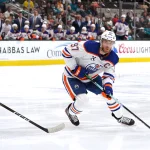 Apr 8, 2026; San Jose, California, USA; Edmonton Oilers center Connor McDavid (97) controls the puck while defended by San Jose Sharks left wing William Eklund (72) during the first period at SAP Center at San Jose.