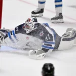 Apr 2, 2026; Dallas, Texas, USA; Winnipeg Jets goaltender Connor Hellebuyck (37) looks up from the ice during the first period against the Dallas Stars at the American Airlines Center.