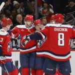 Mar 3, 2026; Washington, District of Columbia, USA; Washington Capitals right wing Ryan Leonard (9) celebrates with teammates after scoring a goal against the Utah Mammoth during the third period at Capital One Arena.