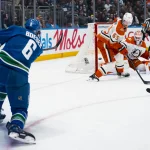 Mar 24, 2026; Vancouver, British Columbia, CAN; Anaheim Ducks defenseman Jacob Trouba (65) watches as Vancouver Canucks forward Brock Boeser (6) scores on Anaheim Ducks goalie Lukas Dostal (1) in the second period at Rogers Arena.