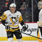 Apr 25, 2026; Philadelphia, Pennsylvania, USA; Pittsburgh Penguins center Sidney Crosby (87) and goaltender Arturs Silovs (37) celebrate win against the Philadelphia Flyers during the third period in game four of the first round of the 2026 Stanley Cup Playoffs at Xfinity Mobile Arena.