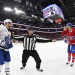 Nov 22, 2025; Montreal, Quebec, CAN; linesman Libor Suchanek (60) seperates Toronto Maple Leafs forward Dakota Joshua (81) and Montreal Canadiens defenseman Arber Xhekaj (72) after the game at the Bell Centre.