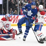 Un célèbre analyste sportif annonce qu'il quitte son poste Dec 6, 2025; Toronto, Ontario, CAN; Montreal Canadiens goalie Jakub Dobes (75) makes a save as defenseman Alexandre Carrier (45) covers Toronto Maple Leafs forward Dakota Joshua (81) in the third period at Scotiabank Arena. Mandatory Credit: Dan Hamilton-Imagn Images