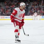 Apr 2, 2026; Philadelphia, Pennsylvania, USA; Detroit Red Wings right wing Alex Debrincat (93) reacts after scoring a goal against the Philadelphia Flyers in the first period at Xfinity Mobile Arena.