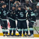 Mar 10, 2026; Seattle, Washington, USA; Seattle Kraken, from left, defenseman Jamie Oleksiak (24), forward Shane Wright (51), forward Kaapo Kakko (84), forward Berkly Catton (27) and defenseman Ryker Evans (41) celebrate a goal during the first period against the Nashville Predators at Climate Pledge Arena.