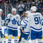 Jan 29, 2026; Seattle, Washington, USA; Toronto Maple Leafs, from left, defenseman Morgan Rielly (44), forward Auston Matthews (34), forward Max Domi (11) and forward John Tavares (91) celebrate a goal during the third period at Climate Pledge Arena.
