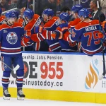 Oct 11, 2025; Edmonton, Alberta, CAN; The Edmonton Oilers celebrate a goal scored by forward Noah Philp (48), his first goal in the NHL, during the second period against the Vancouver Canucks at Rogers Place.