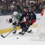 Feb 25, 2025; Columbus, Ohio, USA; Columbus Blue Jackets defenseman Zach Werenski (8) takes the puck off the stick of Dallas Stars right wing Evgenii Dadonov (63) during the first period at Nationwide Arena.