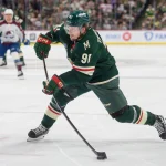 May 9, 2026; Saint Paul, Minnesota, USA; Minnesota Wild right wing Vladimir Tarasenko (91) shoots, would get the assist as the rebound goes in the Colorado Avalanche net in the second period of game three of the second round of the 2026 Stanley Cup Playoffs at Grand Casino Arena.