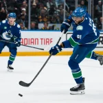 Mar 24, 2026; Vancouver, British Columbia, CAN; Vancouver Canucks forward Evander Kane (91) shoots against the Anaheim Ducks in the second period at Rogers Arena.