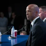 Jun 4, 2026; Vancouver, BC, CANADA; General manager Ryan Johnson and Manny Malhotra listen to a question from the media during a press conference where the Vancouver Canucks introduce Malhotra as their new head coach during a press conference at Rogers Arena.