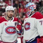 May 21, 2026; Raleigh, North Carolina, USA; Montreal Canadiens center Nick Suzuki (14) and goaltender Jakub Dobes (75) speak during the third period against the Carolina Hurricanes in game one of the Eastern Conferene Final of the 2026 Stanley Cup Playoffs at Lenovo Center. Mandatory Credit: James Guillory-Imagn Images