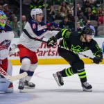 Dec 2, 2021; Dallas, Texas, USA; Columbus Blue Jackets defenseman Zach Werenski (8) defends against Dallas Stars center Tyler Seguin (91) during the second period at the American Airlines Center. Mandatory Credit: Jerome Miron-USA TODAY Sports