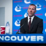 Jun 4, 2026; Vancouver, BC, CANADA; General manager Ryan Johnson speaks in a press conference where the Vancouver Canucks introduce Manny Malhotra as their new head coach at Rogers Arena.