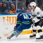 Apr 14, 2026; Vancouver, British Columbia, CAN; Los Angeles Kings forward Quinton Byfield (55) checks Vancouver Canucks forward Elias Pettersson (40) in the second period at Rogers Arena. Mandatory Credit: Bob Frid-Imagn Images