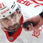 Jan 1, 2026; Pittsburgh, Pennsylvania, USA; Detroit Red Wings center Dylan Larkin (71) waits for the puck drop on a face-off against the Pittsburgh Penguins during the first period at PPG Paints Arena.