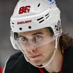 Mar 24, 2026; Dallas, Texas, USA; New Jersey Devils center Jack Hughes (86) prepares to take the face-off against the Dallas Stars during the first period at the American Airlines Center. Mandatory Credit: Jerome Miron-Imagn Images