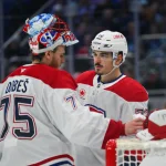 Oct 28, 2025; Seattle, Washington, USA; Montreal Canadiens goaltender Jakub Dobes (75) and Montreal Canadiens defenseman Arber Xhekaj (72) talk during the third period against the Seattle Kraken at Climate Pledge Arena. Mandatory Credit: Steven Bisig-Imagn Images