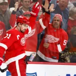 Nov 9, 2021; Detroit, Michigan, USA; Detroit Red Wings center Dylan Larkin (71) celebrates his goal in the second period against the Edmonton Oilers at Little Caesars Arena.